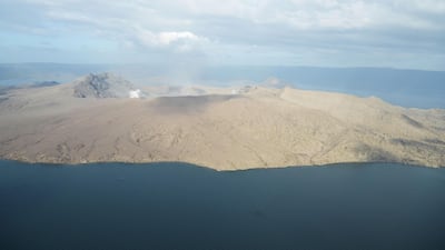 White steam emits from Taal volcano crater as seen from a Philippine airforce helicopter during an aerial survey. Ted Aljibe / AFP