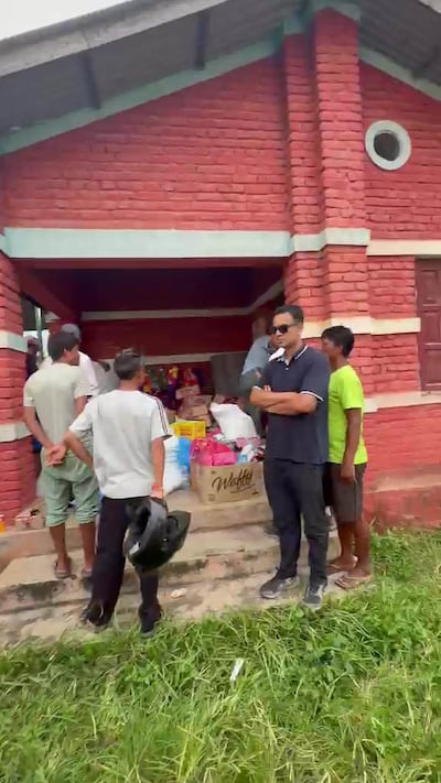 Businessman Shree Lamichhane, right, brought food, blankets and medical supplies to the flood-hit Nuwakot district within days of Nepal's catastrophic flood. Photo: Shree Lamichhane