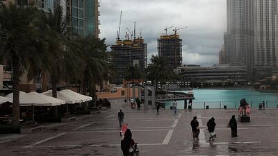 Dubai Police tweeted a warning to drivers on Saturday afternoon, advising motorists to reduce speeds during rain to keep their vehicles from sliding. Satish Kumar / The National
