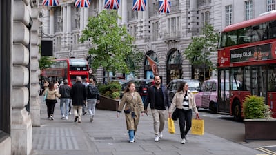 Shoppers in London. Ordinary people feel poorer and left behind by the stock market boom. Getty Images