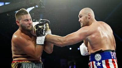Tyson Fury, of England, lands a left to Tom Schwarz, of Germany, during a heavyweight boxing match in Las Vegas. AP Photo