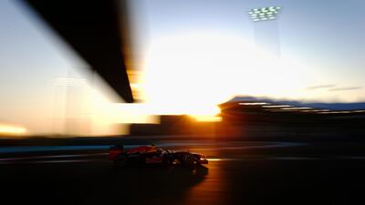 Mark Webber's Red Bull caught in the shadows of sunset over Abu Dhabi. Paul Gilham/Getty Images
