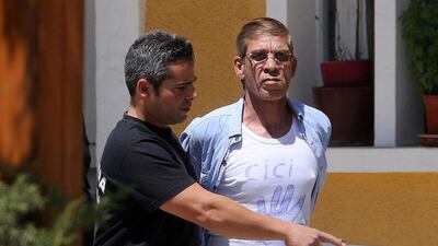 Seif Al Mostafa, right, who hijacked an EgyptAir passenger plane, is transferred by Cypriot police to a court in Nicosia, Cyprus. Yiannis Kourtoglou / Reuters