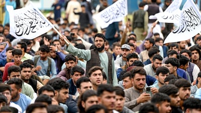 Afghan fans wave Taliban flags as they watch a live broadcast of the ICC men's T20 World Cup semi-final. AFP