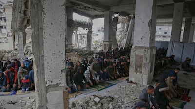 Palestinians are determined to attend Friday prayers despite damage wrought by the Israeli army on Imam Shafi'i Mosque, in Gaza city. AP