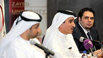 Left to right, Maj Omar al Tunaiji, the head of Abu Dhabi Police’s cyber-crime branch; Sulaiman al Jassim, the vice president of Zayed University; and Ibrahim Bagilli, the director of the university’s cyber-crime lab, announce the conference yesterday. Pawan Singh / The National