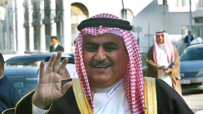 Bahraini Foreign Minister Khalid bin Ahmed Al Khalifa waves to journalists upon his arrival to attend the opening session of the Arab foreign ministers meeting in Tunis. AP Photo