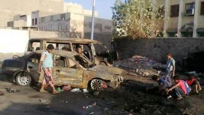 Yemeni boys gather near destroyed vehicles following clashes between security forces and southern separatists in Aden. EPA
