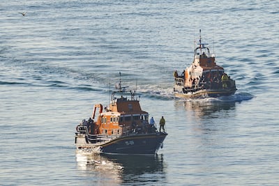 Two RNLI lifeboats brings in a group of migrants into Dover Port that were found crossing the English Channel in an inflatable dinghy on August 10, 2023 in Dover, England. Getty Images
