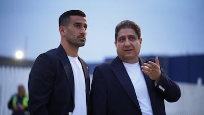 Iran's Ehsan Hajsafi, left, arrives ahead of the World Cup. Reuters