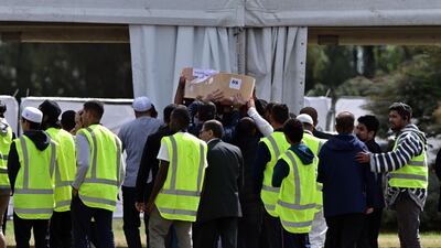 Mourners carry the coffins of Khalid Mustafa and his son Hamza Mustafa. AFP