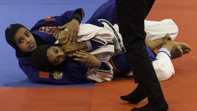 Maryam Khamis Al Qatbi of Oman, left, fights Shamma Khalid Al Mansoori of UAE during their 48kg teen grey belt semi-final bout during the Abu Dhabi World Youth Jiu Jitsu Championship at Ipic Arena on April 16, 2017. Christopher Pike / The National