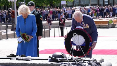 Britain's Prince Charles and Camilla, Duchess of Cornwall, lay a wreath at the National War Memorial in Ottawa on May 18, 2022. AFP