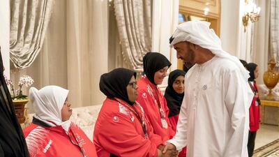 Sheikh Mohammed bin Zayed, Crown Prince of Abu Dhabi and Deputy Supreme Commander of the UAE Armed Forces (R), receives members of the UAE Special Olympics team, during a Sea Palace barza. Rashed Al Mansoori / Crown Prince Court - Abu Dhabi