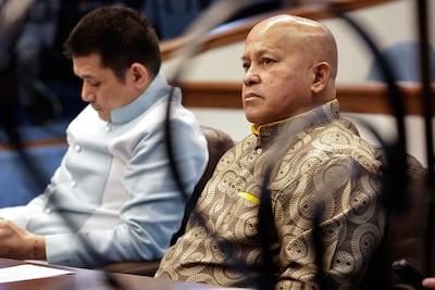 Philippine Senator Ronald dela Rosa, right, a former national police chief under former president Rodrigo Duterte, attends a session at the Senate. EPA