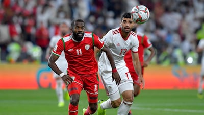 Oman forward Saad Al Mukhaini battles with Iran Mehdi Taremi during the Asian Cup last-16 match. Getty Images
