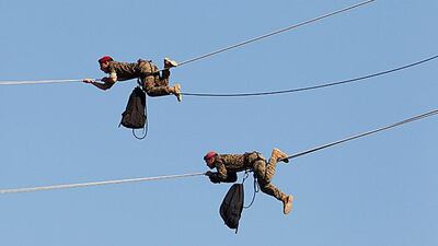 Lebanese soldiers glide on ropes during a military parade to celebrate the 68th anniversary of Lebanon's independence in Beirut. Mohamed Azakir / Reuters