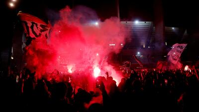 Flares are set off outside Parc des Princes after PSG win the Ligue 1 title. Reuters