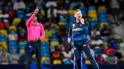 Namibia's Bernard Scholtz celebrates the dismissal of Oman's Zeeshan Maqsood. AFP
