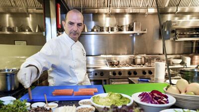 Chef Alessandro Montedoro, executive chef at Ritz Carlton Abu Dhabi, recommends adding a splash of water to an olive oil dressing to make it less heavy but no less tasty. Photo: Victor Besa / The National