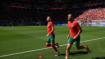 Morocco's Hakim Ziyech, left, and Romain Saiss warm up ahead of their World Cup Qatar 2022 Group F match against Croatia at the Al Bayt Stadium in Al Khor, north of Doha. AFP