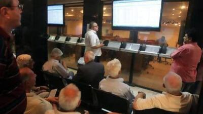 Iraqi investors at the ISX in Baghdad. Asiacell's successful IPO has almost doubled the exchange's market cap overnight. Ahmad Al-Rubaye / AFP