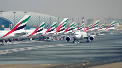 A picture take on September 14, 2017 shows Emirates planes parked at the tarmac at Dubai's International Airport.
/ AFP PHOTO / GIUSEPPE CACACE