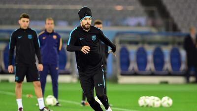 Barcelona’s Gerard Pique in action on Wednesday during training in Japan. Yoshikazu Tsuno / AFP