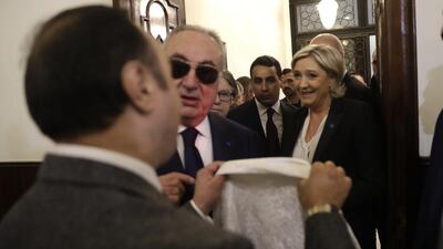An aide of Lebanon’s Grand Mufti Sheikh Abdel-Latif Derian, left, gives a headscarf to French far-right presidential candidate Marine Le Pen, right, upon her arrival at Dar Al-Fatwa who refused to wear the scarf for a meeting with the mufti in Beirut, Lebanon, on February 21, 2017. Hussein Malla/AP Photo