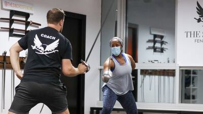 Josephine Kabambi, 32, from the US, enjoys a sword-fighting session