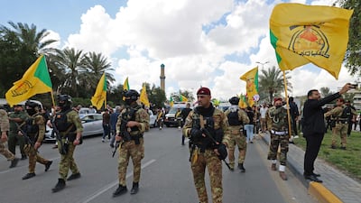 Members of Iraq's pro-Iran paramilitary group Kataib Hezbollah in Baghdad on April 8. The US is stepping up bounty operations against such groups in Iraq. AFP