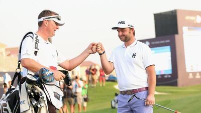 Andy Sullivan celebrates with his caddie Sean Mcdonagh after his birdie on the 18th. Andrew Redington / Getty Images