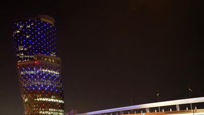 Capital Gate is illuminated in the French national colours in tribute for the victims of the November 13 Paris attacks. Ravindranath K / The National