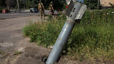 An unexploded shell is stuck in the ground in Lysychansk. euters