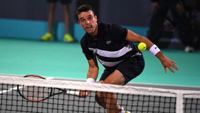 Spain's Roberto Bautista Agut in action against Andrey Rublev of Russia during their quarter-final match at the Mubadala World Tennis Championship in Abu Dhabi. Martin Dokoupil / EPA