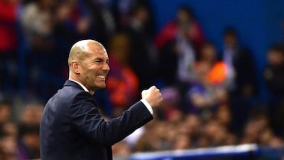 Real Madrid manager Zinedine Zidane celebrates on the sideline during his club's second-leg, semi-final match with Atletico Madrid at the Vicente Calderon stadium in Madrid, on May 10, 2017. Pierre-Philippe Marcou / AFP