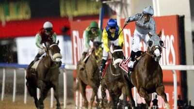 Jockey Victor Espinoza, right, on California Chrome, celebrates after winning the Dubai World Cup at the Meydan Racecourse in Dubai, UAE on 26 March 2016.The Dubai World Cup is the richest events in the horse racing sporting calendar. EPA/ALI HAIDER