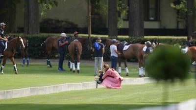 The Duchess of Cambridge and Prince Louis at the Royal Charity Polo Day. AP