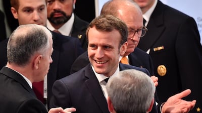 French President Emmanuel Macron (C) and Conference Chairman Wolfgang Ischinger (back) arrive during the Chairman's Interview session at the 56th Munich Security Conference (MSC) in Munich, Germany. EPA