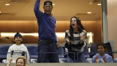 US golfer Tiger Woods reacts as he watches Rafael Nadal of Spain play Marin Cilic of Croatia during their match on the eighth day of the US Open Tennis Championships the USTA National Tennis Center in Flushing Meadows, New York, USA. EPA