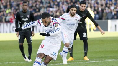 Lyon's Alexandre Lacazette scores a penalty against Metz during their Ligue 1 victory on Sunday. Robert Pratta / Reuters / January 25, 2015