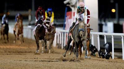 Mike Smith rides Arrogate to the finish line to win the main event of the Dubai World Cup. Ahmed Jadallah / Reuters