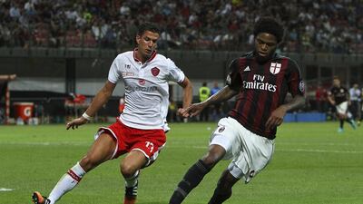 Luiz Adriano, right, of AC Milan is challenged by Marco Rossi of Perugia during their Coppa Italia match at Stadio Giuseppe Meazza on August 17, 2015, in Milan, Italy. Marco Luzzani / Getty Images