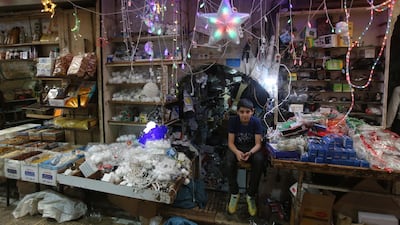 Palestinian vendor waits for customers during Ramadan, in the West Bank city of Nablus. EPA