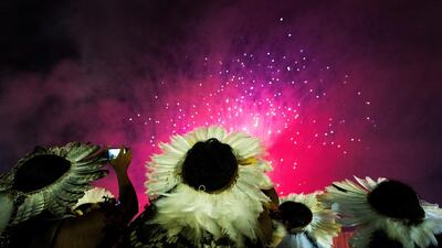 Indigenous people are seen watching fireworks during the first World Games for Indigenous Peoples in Palmas, Brazil. Buda Mendes / Getty Images