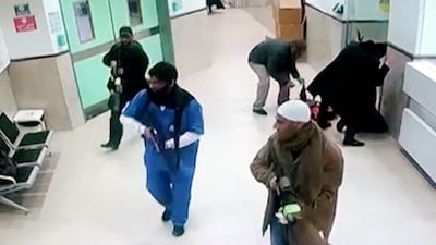 Israeli soldiers disguised as civilians and medical workers enter Ibn Sina Hospital in Jenin on Tuesday. AP