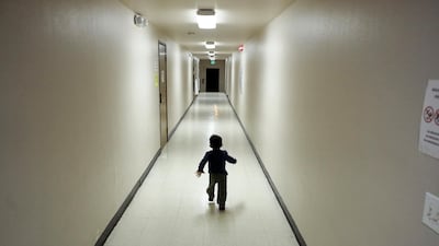 In this Dec. 11, 2018 photo, an asylum-seeking boy from Central America runs down a hallway after arriving from an immigration detention centre to a shelter in San Diego. AP Photo