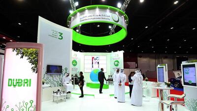 Visitors at the Dewa stand during the Smart Government Exhibition & Conference event at the Dubai World Trade Centre. Satish Kumar / The National