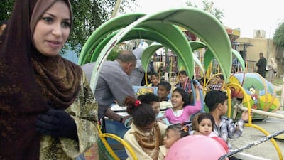 Children celebrate Eid Al Fitr in Baghdad in 2004. This year festivities in the region have been subdued. Mohammed Fala’ah / Getty Images