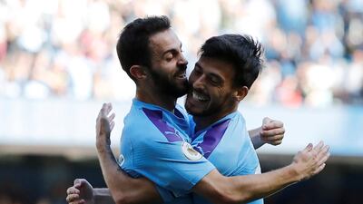 Manchester City's Bernardo Silva celebrates scoring their sixth goal with teammate David Silva. Reuters